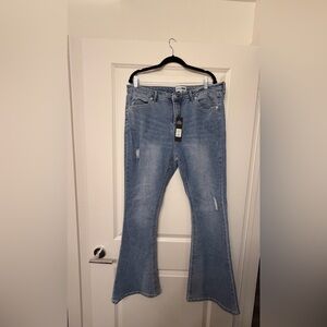 Light Blue Distressed Jeans with Bedazzled Back Pockets